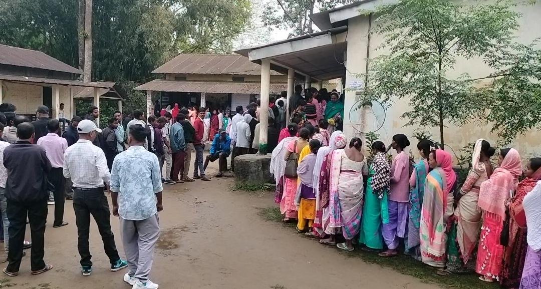 2026 Assembly Polls: Men and women lined up at a polling booth to cast vote in Assam's Tinsukia district.