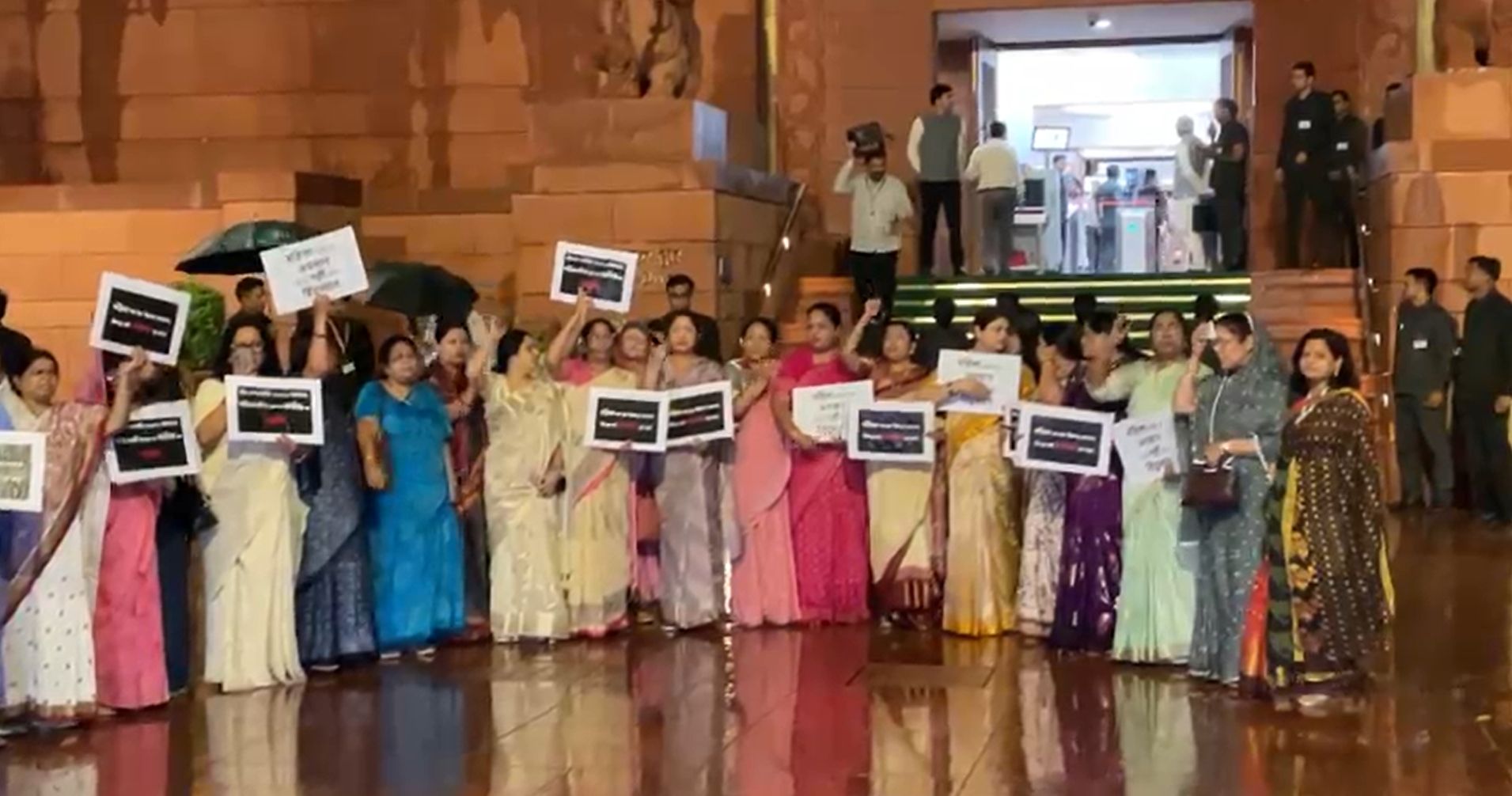 BJP women MPs raise slogans in the Parliament House complex in New Delhi on April 17, 2026, protesting the defeat of the Constitution (131st Amendment) Bill that sought to implement 33% reservation for women in legislatures from 2029.