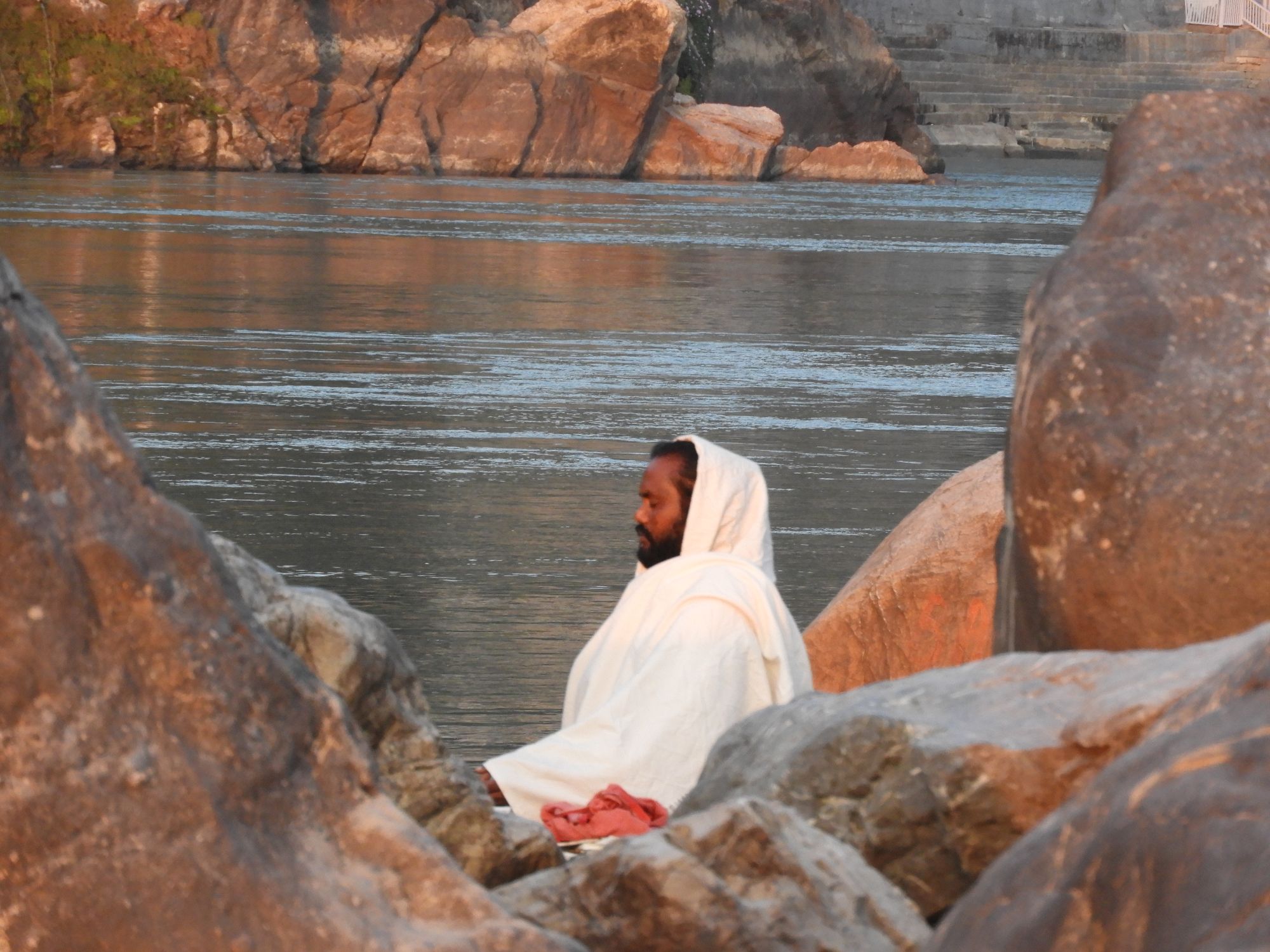 A saint in a deep meditative state near river Ganga in Rishikesh, India
