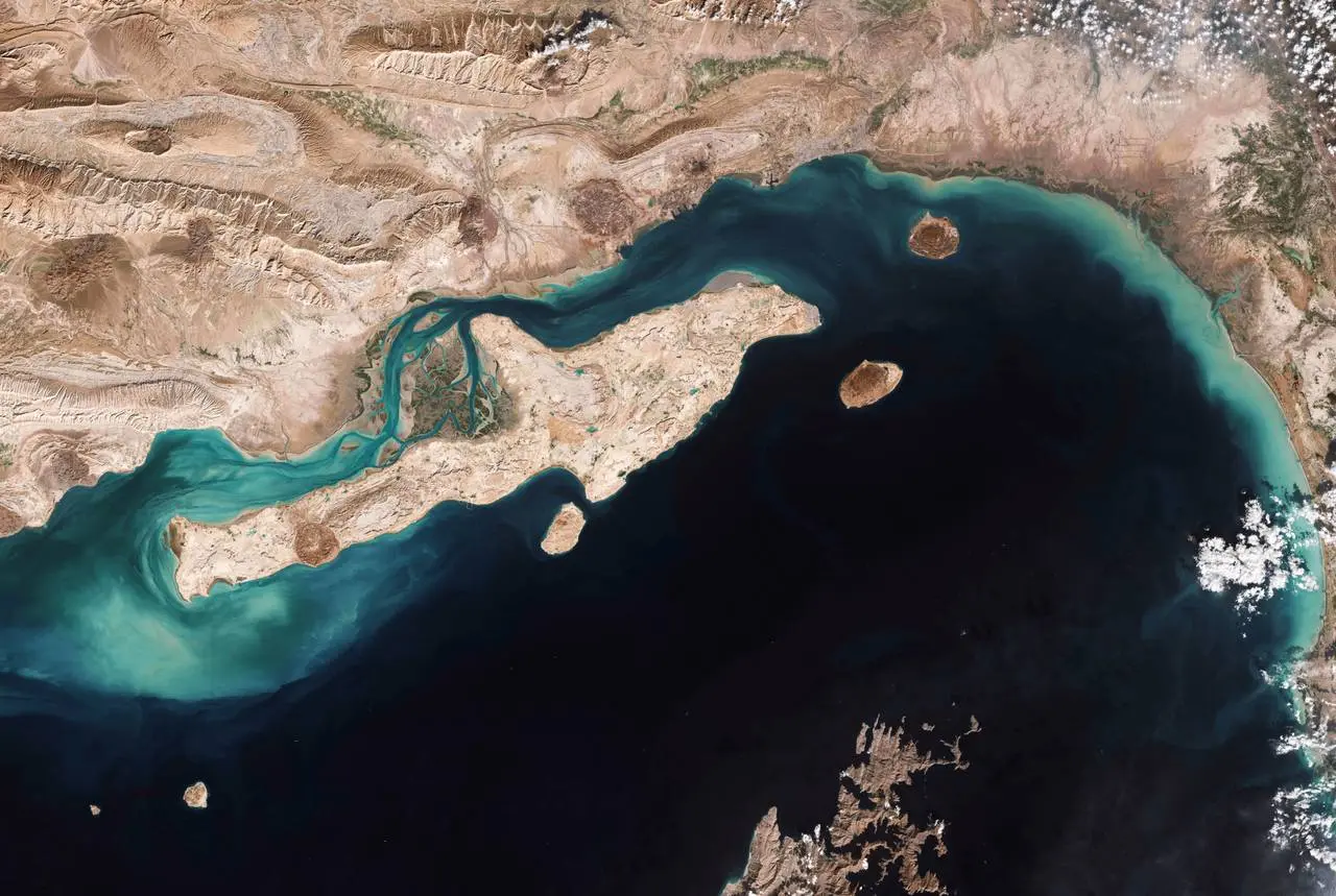 Satellite image of the Strait of Hormuz showing the narrow chokepoint between Iran and the Arabian Peninsula, a critical waterway at the centre of current US-Iran tensions.