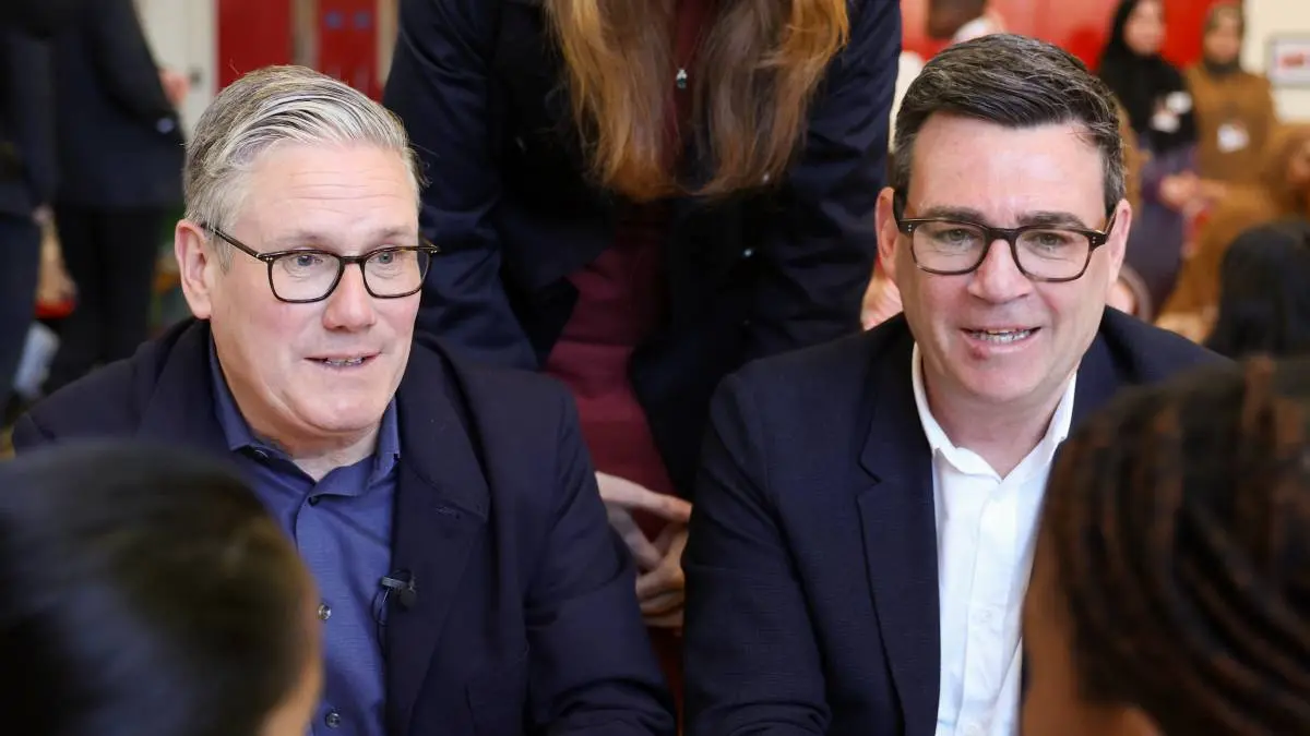 Prime Minister Keir Starmer (left) and Andy Burnham (right), Mayor of Greater Manchester, during their visit to Holy Trinity Church of England Primary School on April 13, 2006.