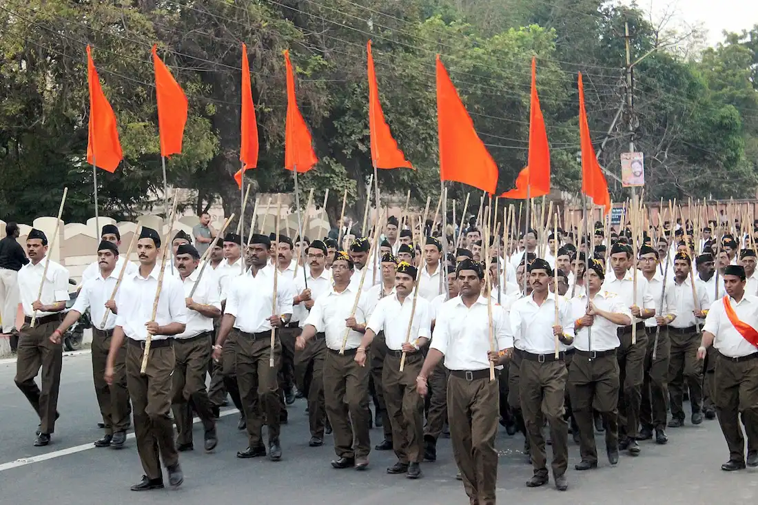 RSS swayamsevaks (volunteers) marching with saffron flag in Bhopal on October 23, 2016