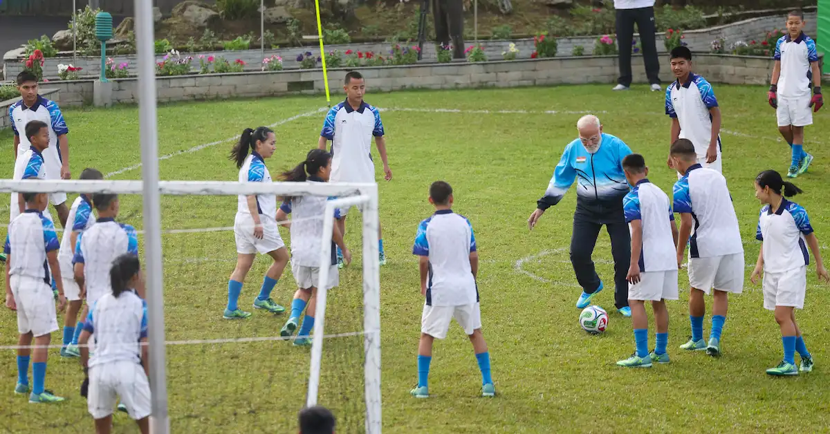 Indian Prime Minister Narendra Modi plays football with youngsters at Gangtok in Sikkim on April 28, 2026.