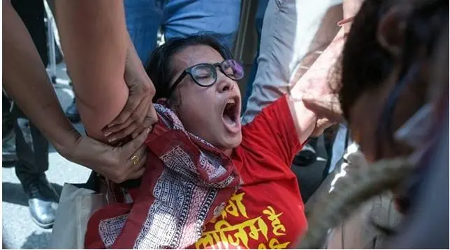 Delhi police personnel whisking away a women who took part in a massive protest against alleged irregularities in Special Intensive Review (SIR) of electoral rolls by the Election Commission of India at Jantar Mantar in Delhi on Oct 2, 2026